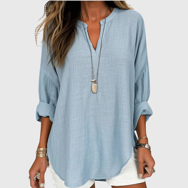 Chemise de plage fluide et élégante pour femme, manches longues, parfaite pour l'été et les vacances.