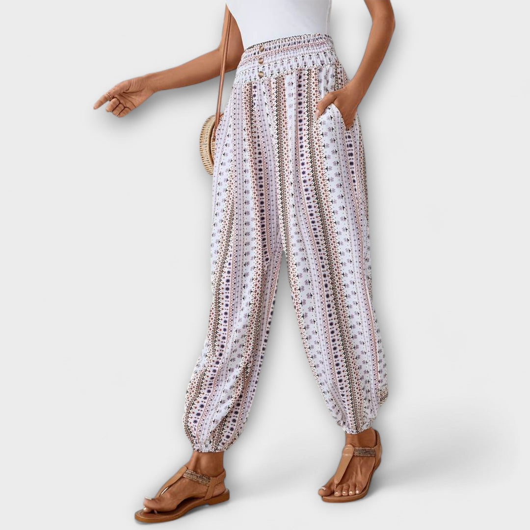 Pantalon Scarlett femme, motif ethnique moderne, offre un confort supérieur et un look élégant.