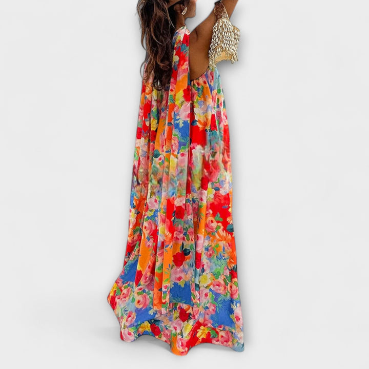 Robe fleurie longue pour femme, design à épaules dénudées, parfaite pour l'été, la plage et les vacances.