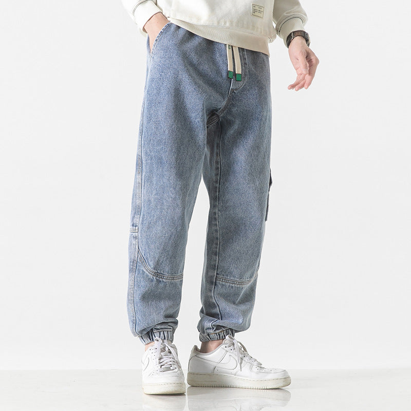 Pantalon jogger homme décontracté gris avec taille élastique, confort urbain pour printemps/automne.