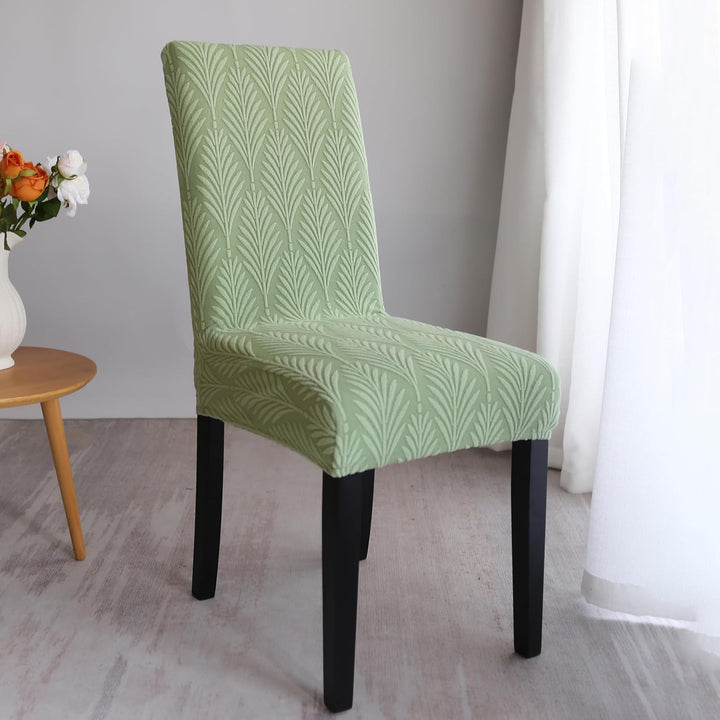 Housse de chaise en polyester doux, motif feuille. Confortable et protectrice pour vos chaises.