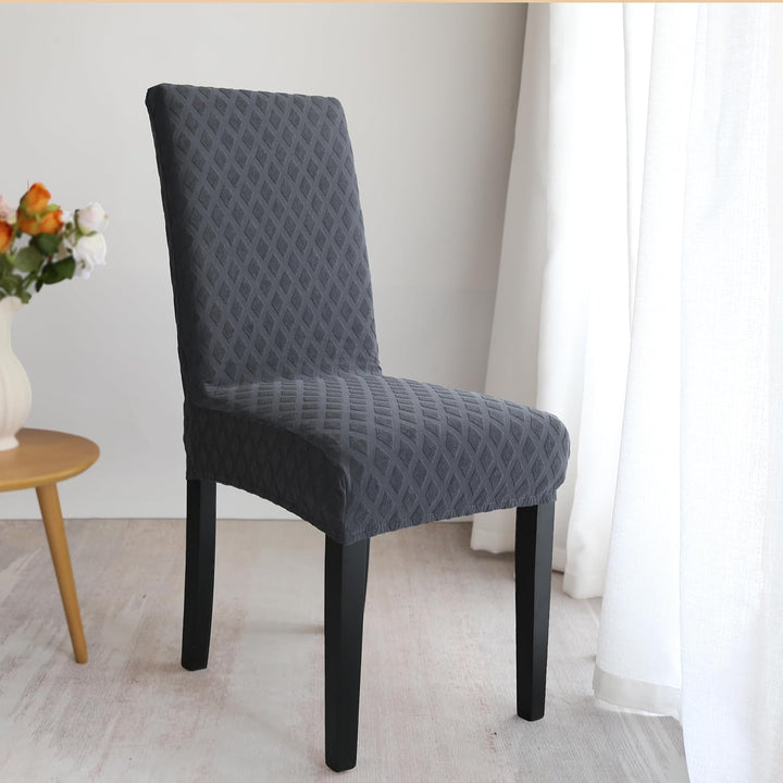 Housse de protection pour chaise de salle à manger en polyester, facile à laver. Ameublement pratique.