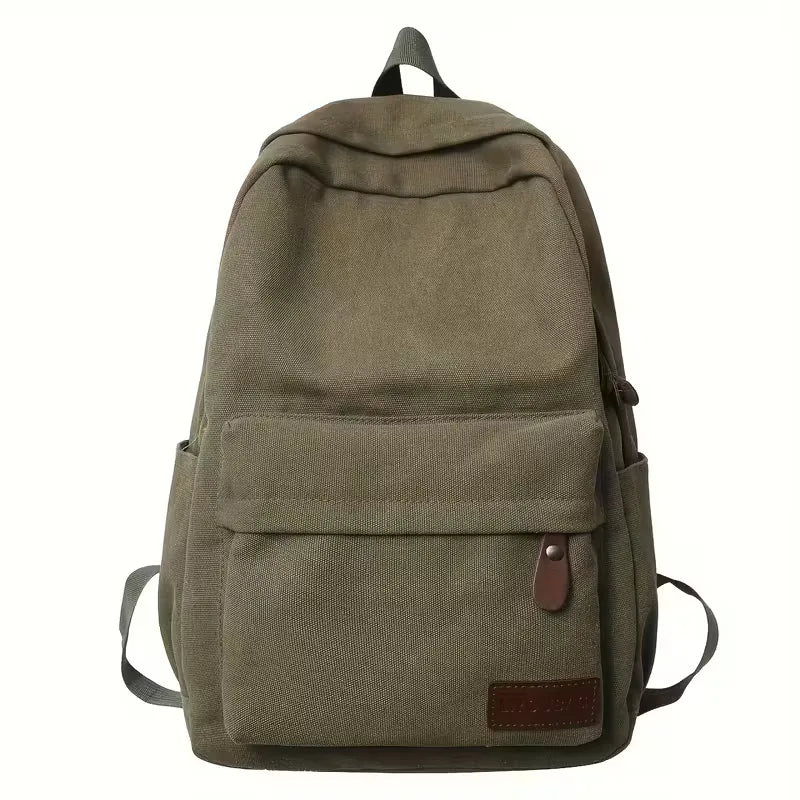 Intérieur organisé d'un sac à dos homme en canvas, idéal pour transporter accessoires de voyage.