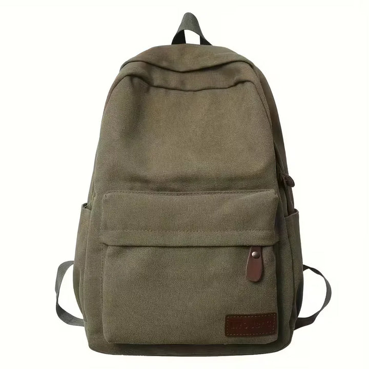Intérieur organisé d'un sac à dos homme en canvas, idéal pour transporter accessoires de voyage.