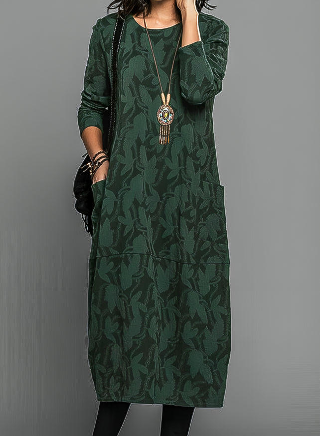 Robe midi ample femme, coupe décontractée et élégante, avec manches longues et poches, parfaite pour la mode féminine.