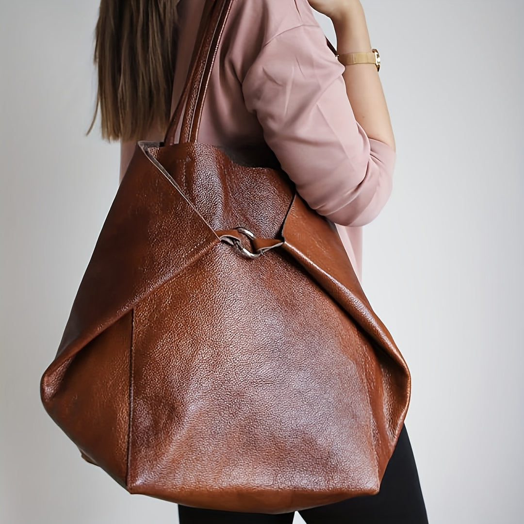 Accessoire tendance: sac tote élégant pour femme en simili cuir doux, un grand sac quotidien indispensable.