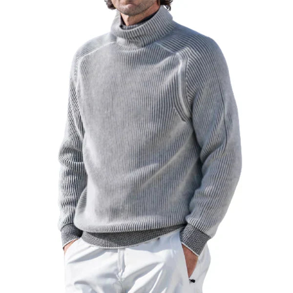 Homme portant pull col roulé noir élégant, tricoté, look sophistiqué pour mode masculine d'hiver.