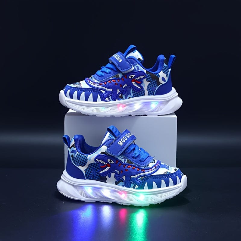 Profil des chaussures de sport garçons, dinosaures et LED visibles. Baskets lumineuses avec scratch, mode enfant.