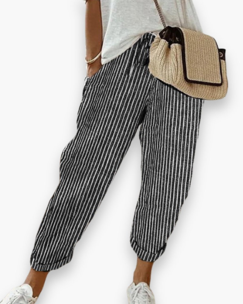 Pantalon femme ample en tissu fluide, doux et respirant. Confortable, taille élastique pour l'été.