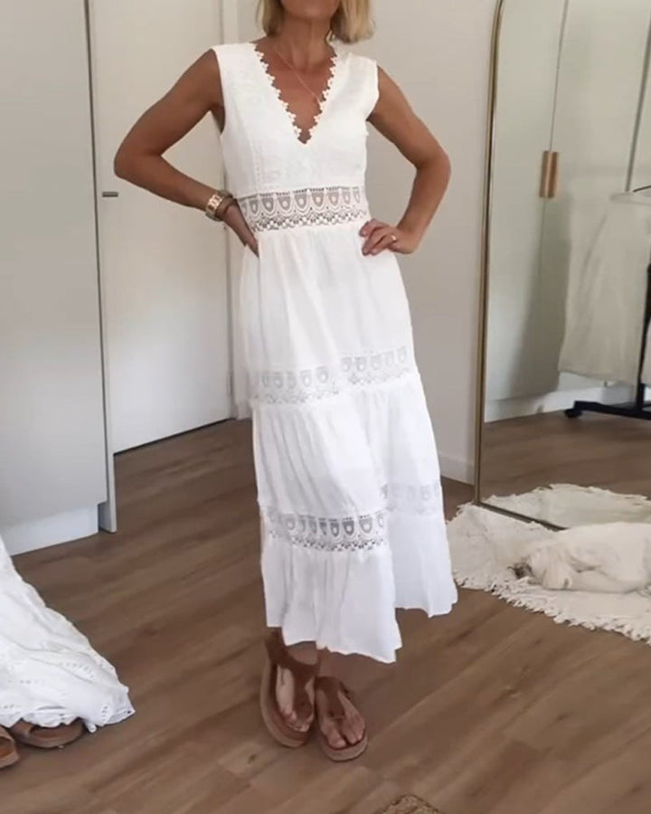 Robe midi femme fluide, col V, sans manches, parfaite pour les journées ensoleillées d'été.