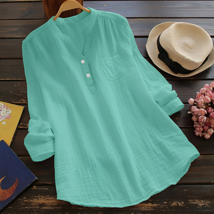 Élégante blouse femme ample au style intemporel, parfaite pour une tenue chic de bureau ou décontractée.