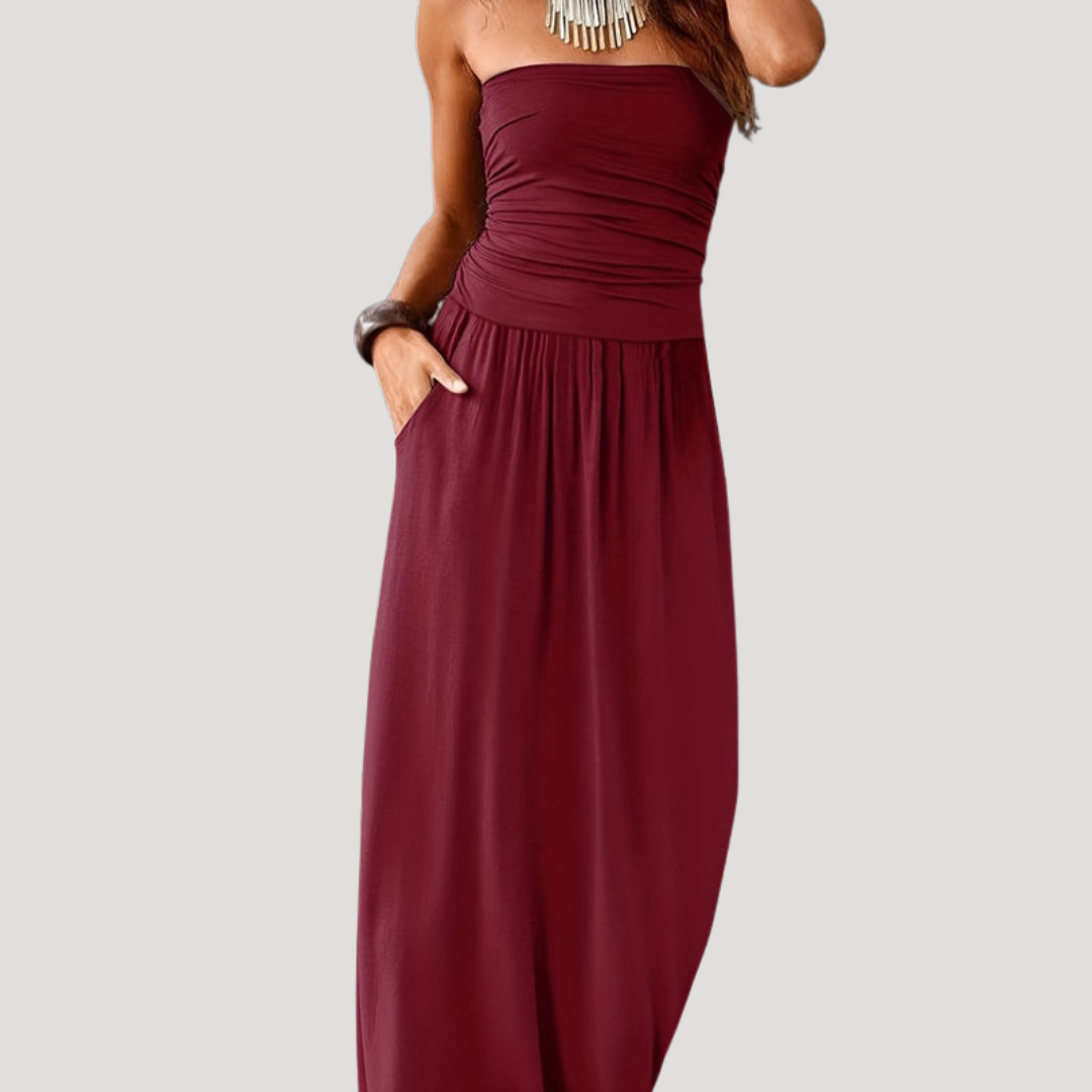 Robe longue femme chic, bustier froncé fluide et élégant, parfaite pour soirée d'été ou vacances.