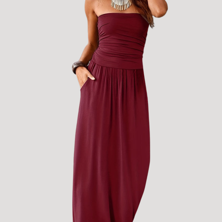 Robe longue femme chic, bustier froncé fluide et élégant, parfaite pour soirée d'été ou vacances.