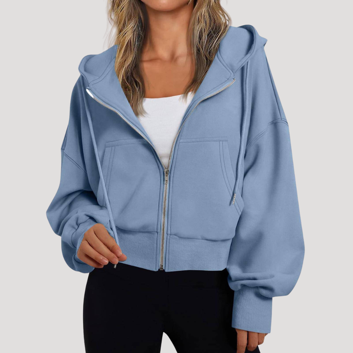 Veste de mode femme à capuche, aux manches ballon contemporaines. Un choix chic et confortable pour la saison.