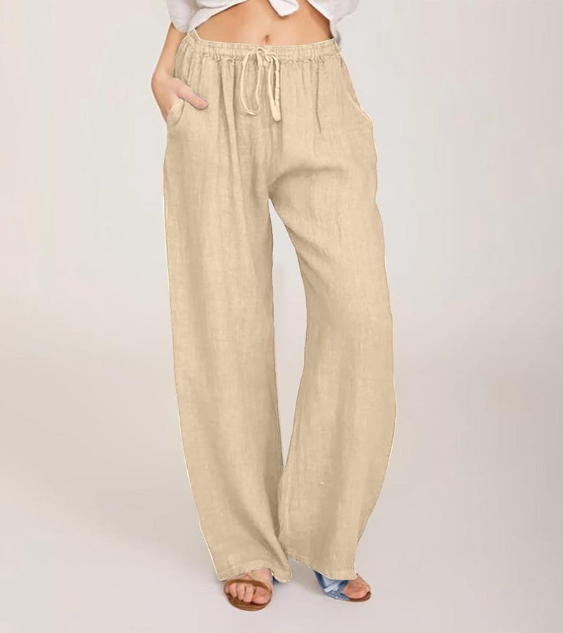 Silhouette femme élégante en pantalon large taille haute en lin, style décontracté estival moderne.