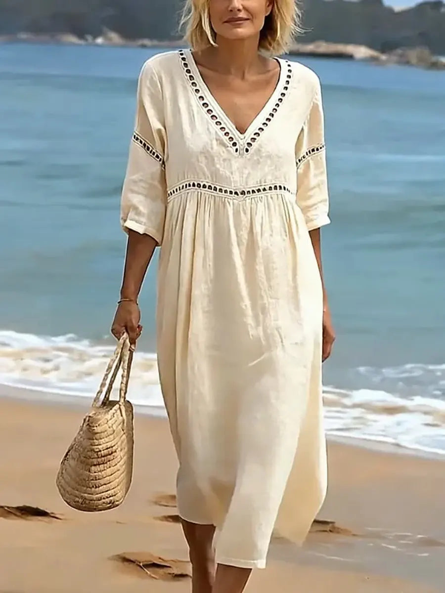 Robe mi-longue femme col V en coton, coupe fluide. Élégante et décontractée pour le printemps et l'été.