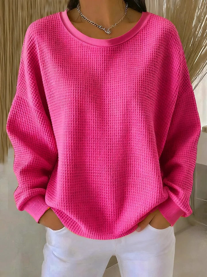 Look moderne avec ce sweat-shirt femme texturé décontracté, alliant chic et simplicité.