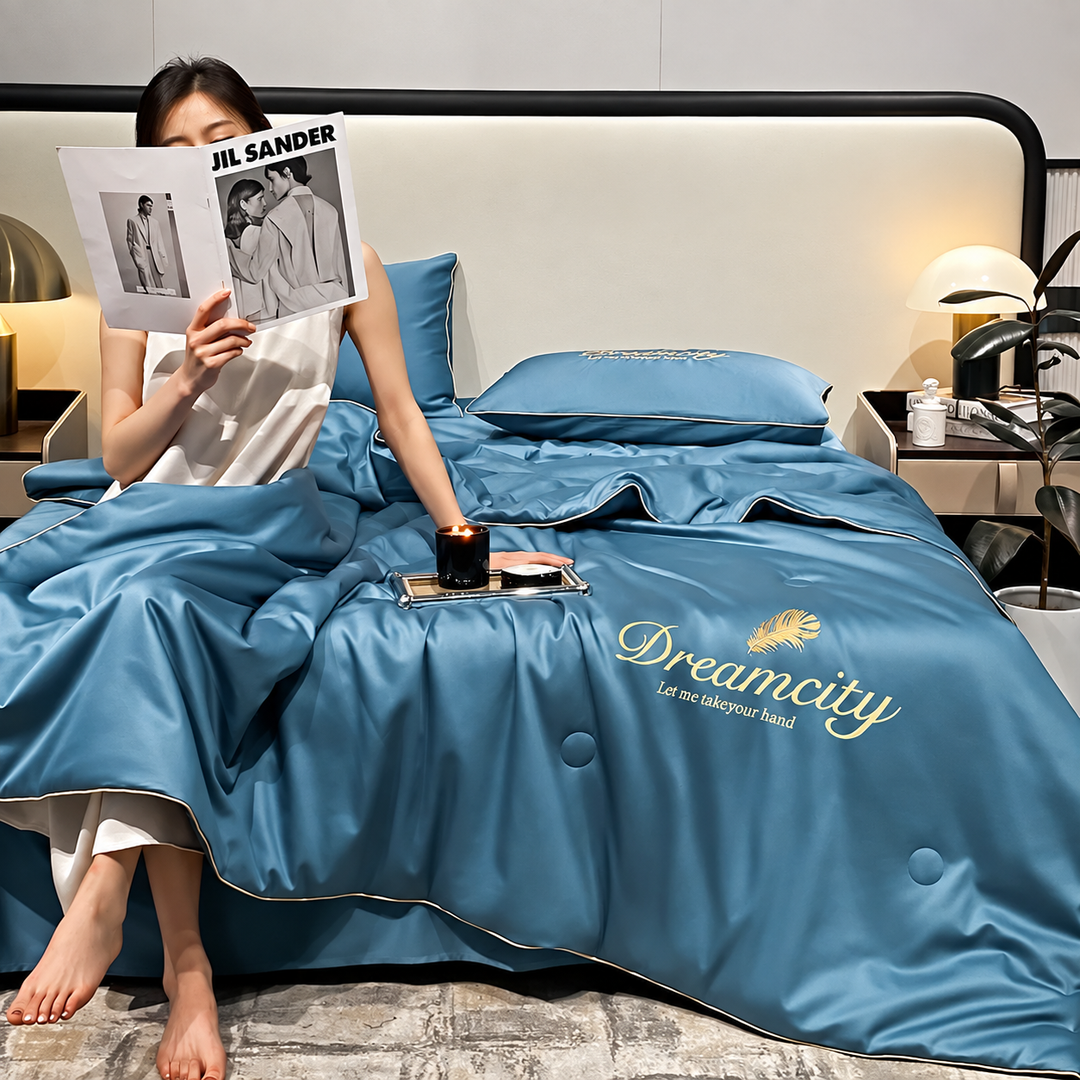 Couverture rafraîchissante en soie glacée pour un sommeil frais et confortable en été.