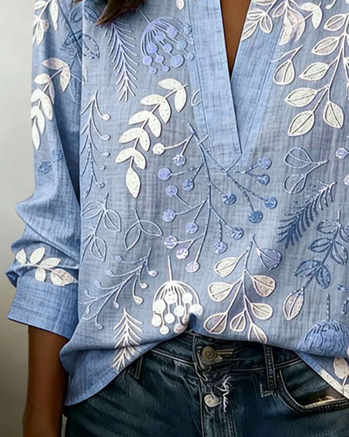 Blouse fluide florale pour femme, col V, manches longues, style élégant et décontracté.