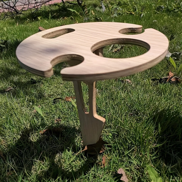 Table de plage pliable Porto Flexi, légère et résistante, pour pique-nique ou apéro au bord de l'eau.