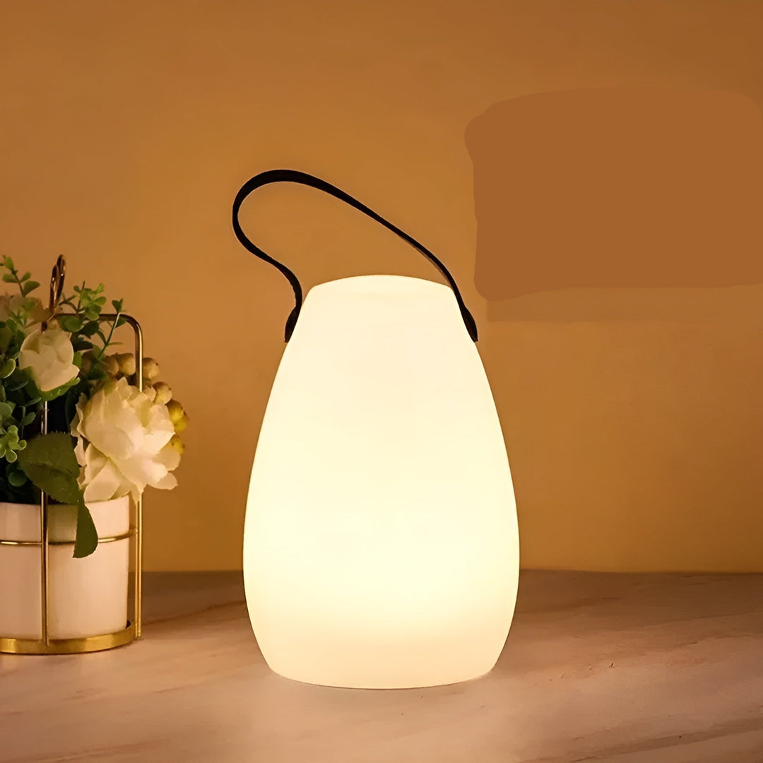 Lampe de table LED portable pour intérieur/extérieur, lumière douce et couleurs variées.