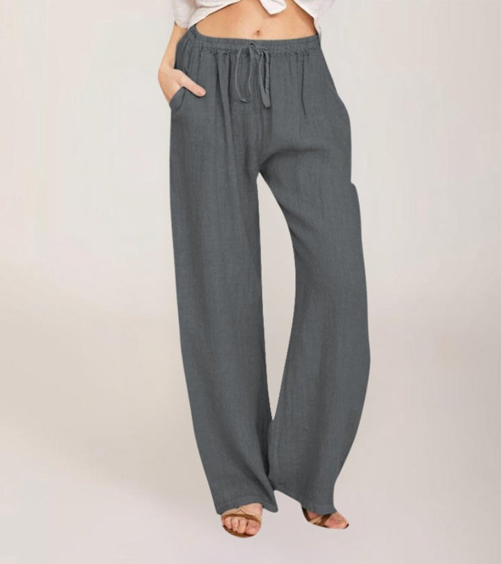Pantalon femme confortable en lin léger, coupe large et taille haute pour les vacances d'été.
