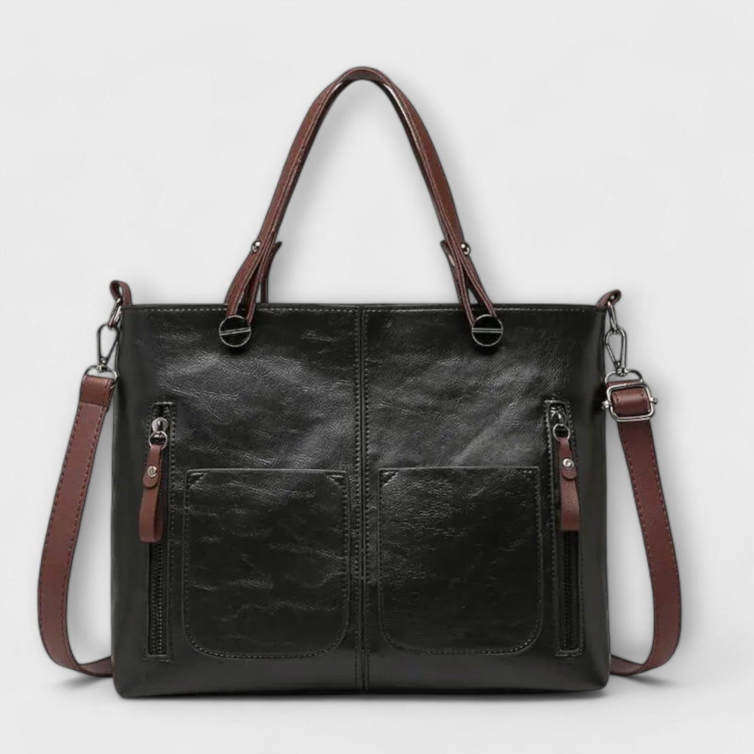 Sac à main femme en cuir noir, style élégant et intemporel. L'accessoire mode indispensable pour un look chic.