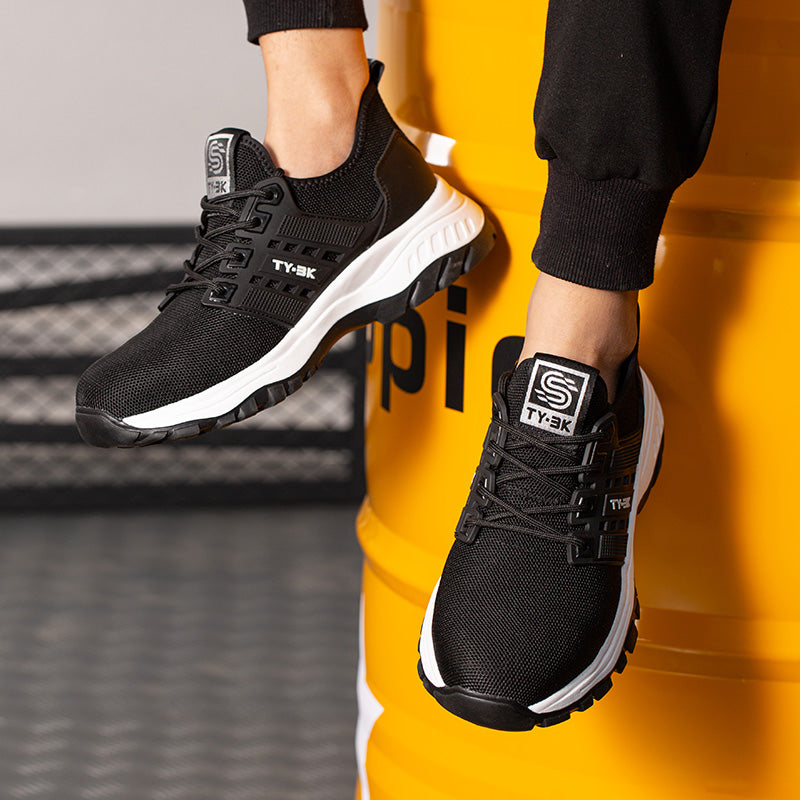 Chaussures de travail orthopédiques robustes pour hommes, design ergonomique et protection latérale efficace.