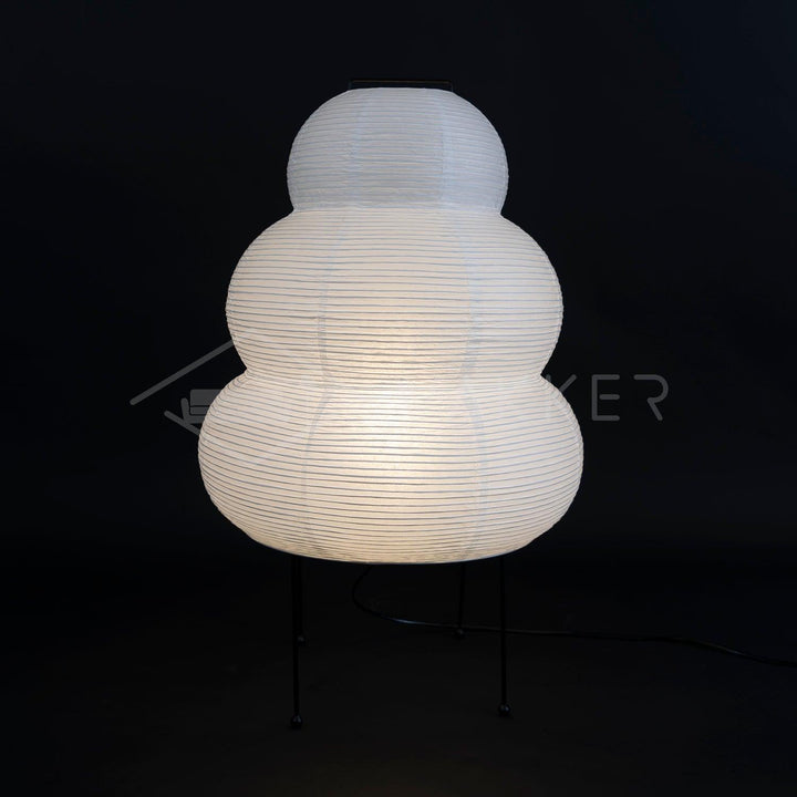 Élégante lampe de table japonaise en papier, design moderne pour éclairage zen et cosy.