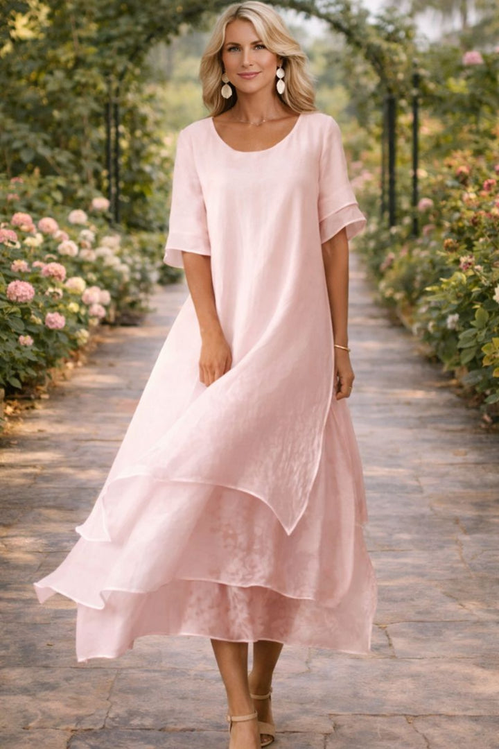 Robe midi fluide femme élégante, idéale pour cérémonie, mariage ou invitée chic. Style mode.
