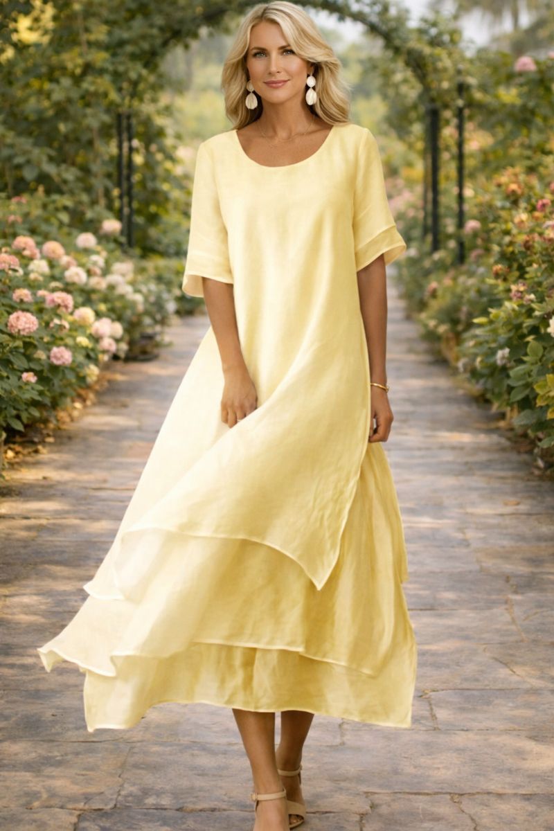 Élégante robe midi fluide femme, coupe chic pour mariage, cérémonie ou événements printemps/été.
