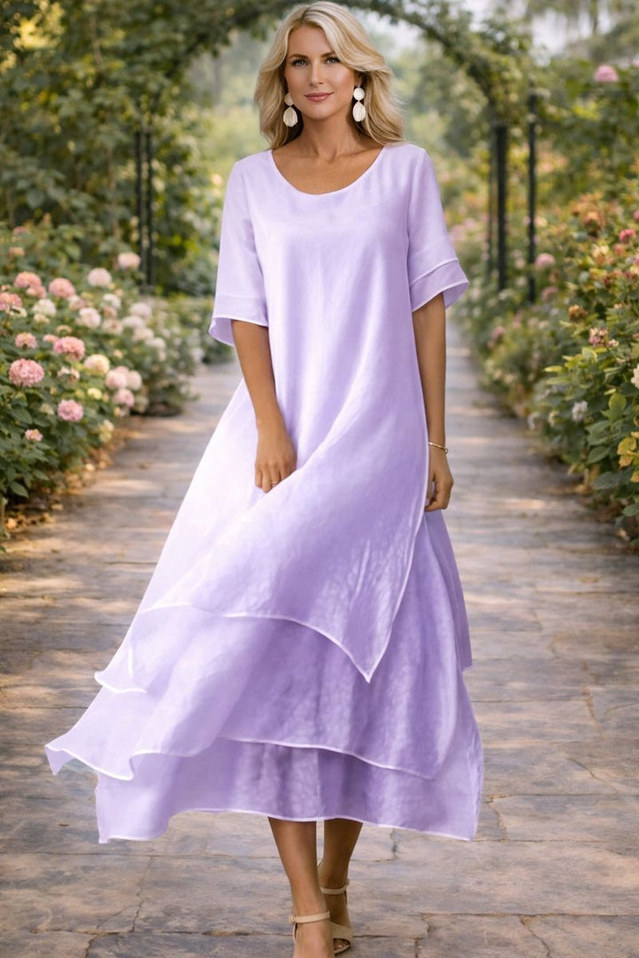 Robe midi fluide femme grandes tailles, élégante et moderne pour mariage, cérémonie ou soirée chic.