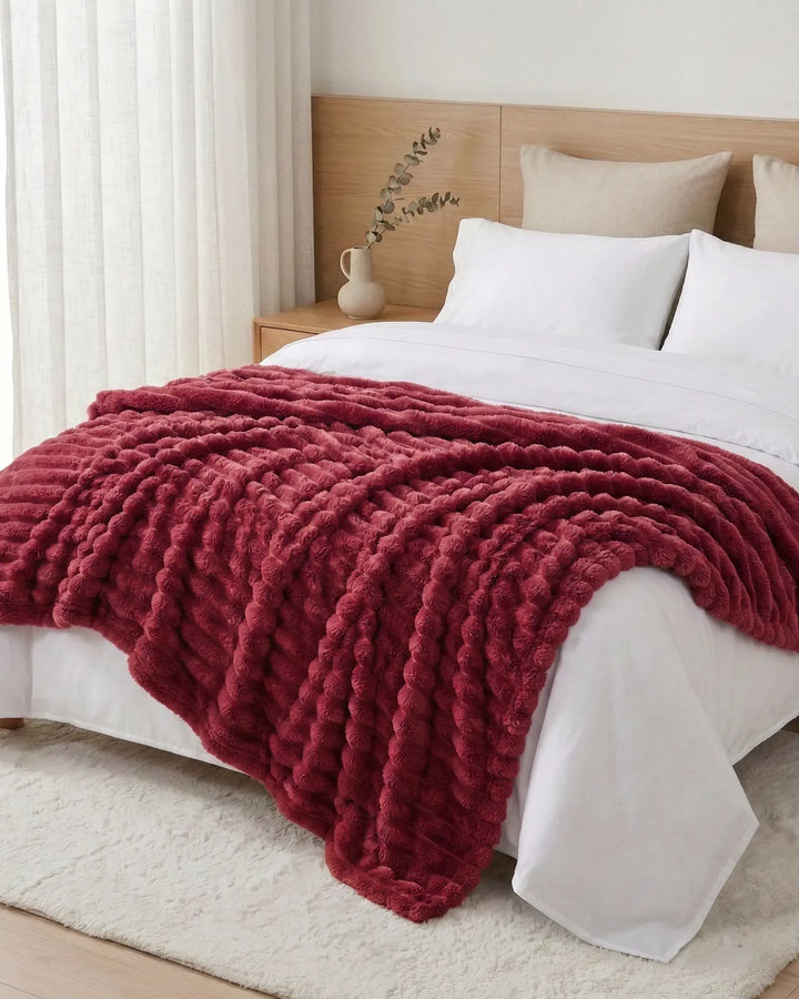 Couverture douce et confortable, parfaite pour les soirées cinéma au salon.