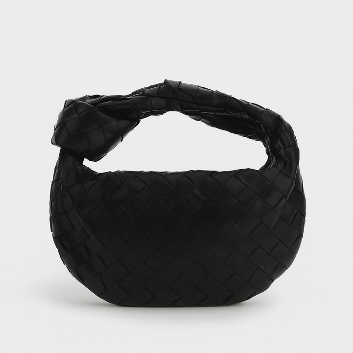 Sac à main tissé élégant femme, finition artisanale chic, accessoire mode indispensable.