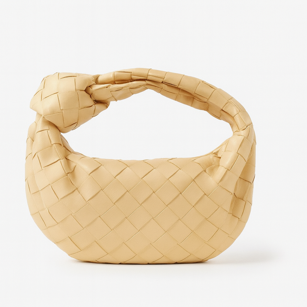 Sac à main chic tissé pour femme, accessoire élégant et polyvalent, confection artisanale de qualité.