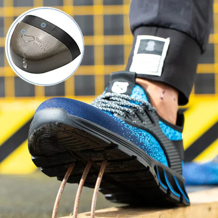 Homme portant des baskets de sécurité unisexes pour travail sur chantier, offrant protection et confort tout au long de la journée.