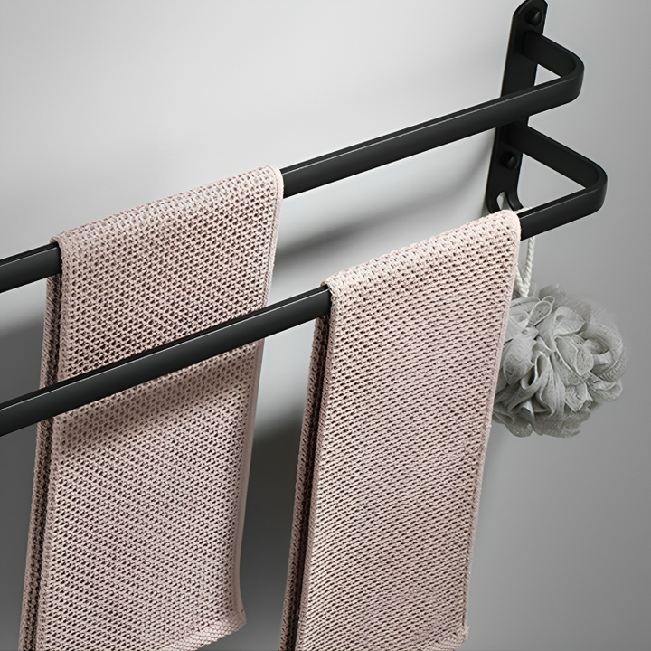 Porte-serviettes DrySpace aluminium noir, design moderne et fixation adhésive, optimisation de l'espace bain.