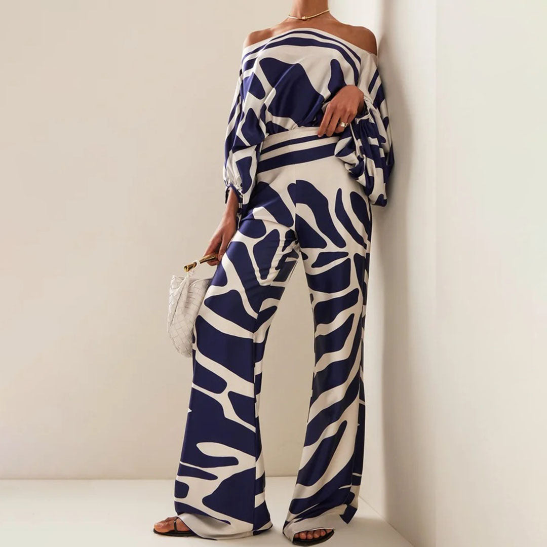 Faites sensation avec cet ensemble femme élégant : top épaules dénudées et pantalon large taille haute. Parfait pour l'été.
