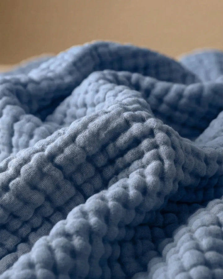 Jeté de canapé en coton 100%, doux et confortable, parfait pour vos moments de détente.