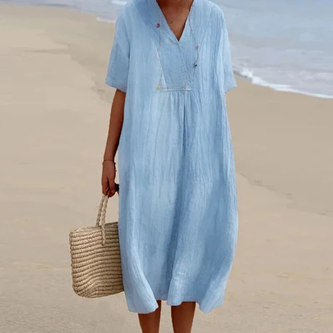 Robe mi-longue femme décontractée, coupe ample pour élégance et confort. Idéale printemps/été.