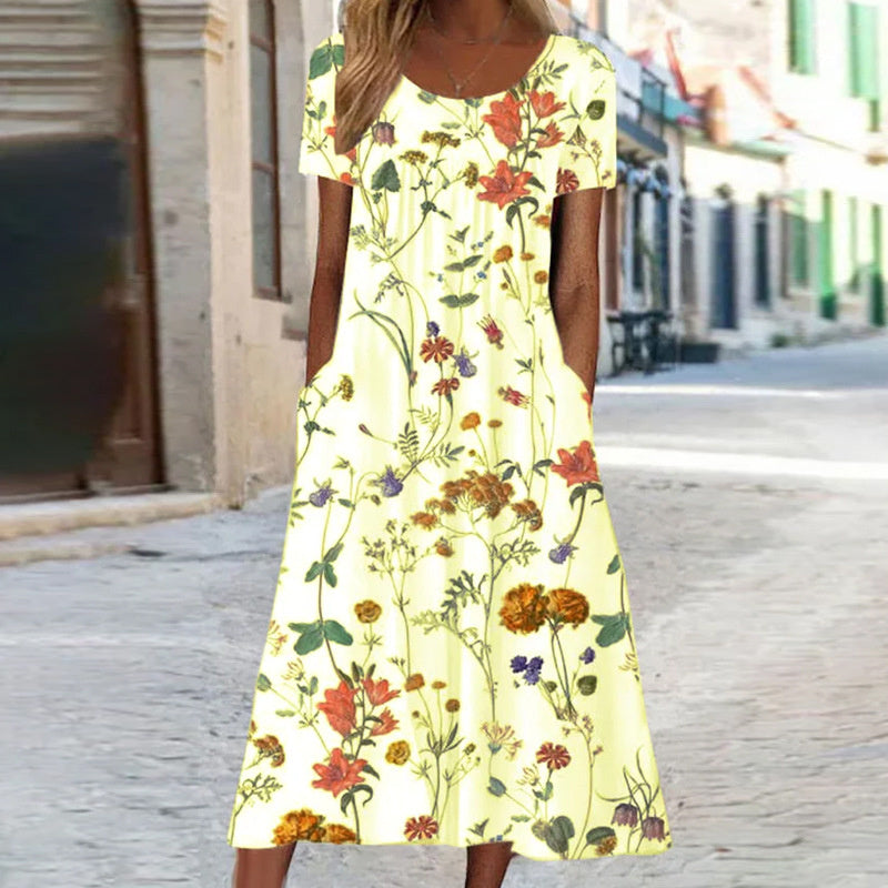 Robe d'été florale chic femme, coupe fluide et légère. Idéale pour un look décontracté élégant en vacances ou printemps.