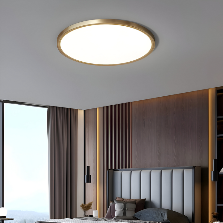 Plafonnier LED rond bronze design, lumière moderne pour un salon élégant.