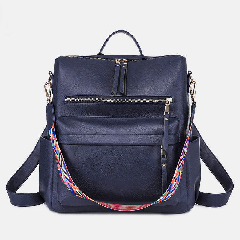 Sac à dos femme imprimé serpent, vert et marron, pour un look chic et sauvage au quotidien.