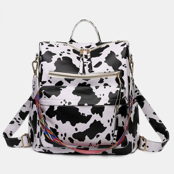 Sac à dos femme, motif serpent, un accessoire mode fonctionnel pour le travail ou les sorties.