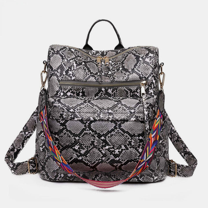 Sac à dos femme, imprimé vache multicolore, l'accessoire parfait pour un style unique.