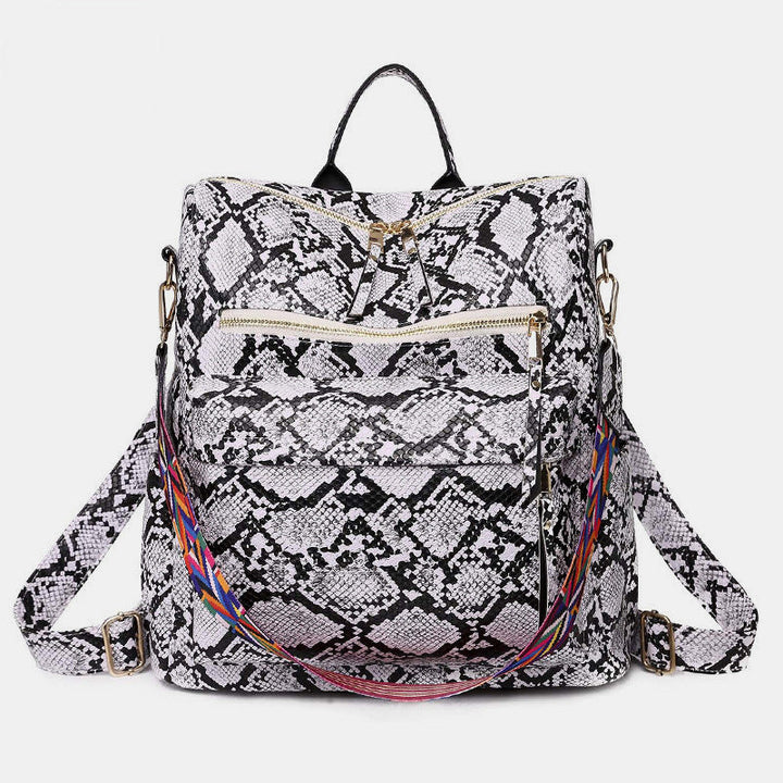 Sac à dos femme, style urbain chic, fonctionnel avec des imprimés animaux variés.