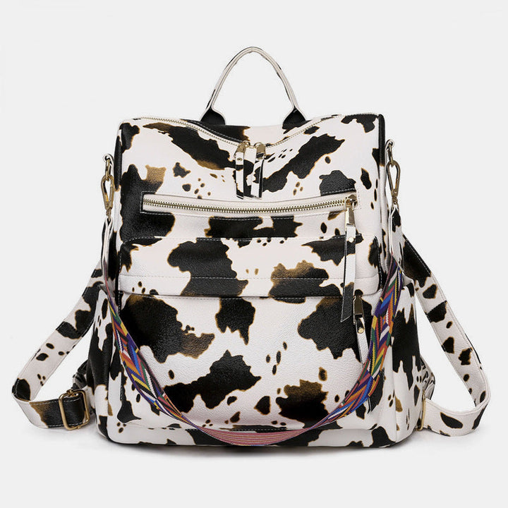Sac à dos élégant femme, vert et marron, idéal pour un look quotidien raffiné et organisé.