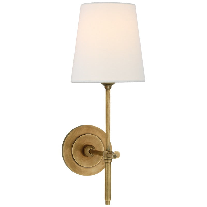 Luminaire mural laiton et tissu beige. Design moderne, crée une ambiance chaleureuse et stylée.