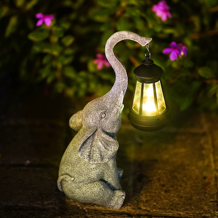 Statue lumineuse éléphant solaire pour jardin, lampe décorative d'extérieur, ambiance douce.