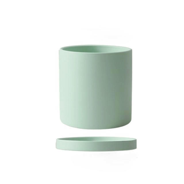 Pot de fleurs moderne haut de gamme avec soucoupe, ajoute une touche luxueuse à l'intérieur de la maison.